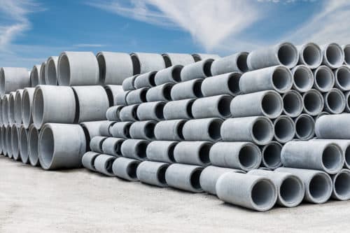 Stack of concrete drainage pipes for wells and water discharges